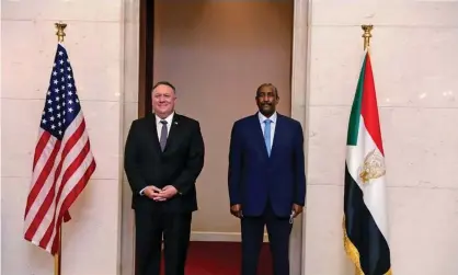  ??  ?? Mike Pompeo with Sudan’s Gen Abdel Fattah al-Burhan, head of the ruling sovereign council, in Khartoum in August. Photograph: AP