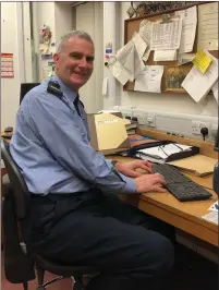  ??  ?? Garda Tim Twomey at his place of work in Bishopstow­n Station and, above left, with his mother Rose at the warm gathering marking his retirement in Cork City last week.