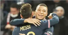  ?? ?? Mbappe celebrates with Lionel Messi after scoring a goal during a French Ligue 1 match. — AFP file photo