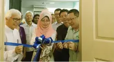  ??  ?? Fatimah, flanked by Dr Ismail (left) and Wee, cuts the ribbon to launch the counsellin­g centre. — Photo by Marlinda Mardzuki