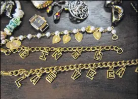  ??  ?? Las Vegas-themed jewelry lays out for sale Dec. 14 at the Not Just Antiques Mart in Las Vegas. Sarah Collins often goes to local thrift and antique stores, like Not Just Antiques Mart, to look for items to sell back at Main Street Peddlers Antique Mall.