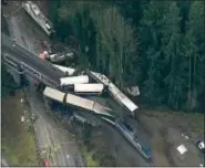  ?? KOMO-TV (VIA AP) ?? An aerial image taken from video shows the derailed Amtrak train.