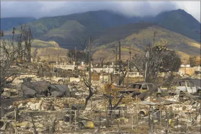  ?? Jae C. Hong / Honolulu Star-Advertiser file photo via AP ?? Damaged property lies scattered in the aftermath of a wildfire in Lahaina, Hawaii, Aug. 21. Officials on Maui plan to send debris and ash from the August wildfire that destroyed Lahaina town to the island’s central landfill. County officials said Thursday, that they picked the site in Kahului as the permanent disposal site for the refuse, the Honolulu Star-Advertiser reported.