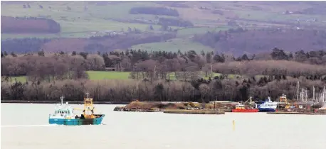  ?? PHOTO BY IAN COOPER ?? A fishing boat in the Menai Strait returning to Bangor.