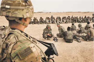  ?? ADAM FERGUSON/THE NEW YORK TIMES ?? U.S. Army soldiers from the 2nd Battalion 87th Infantry Division oversee training of the 215th Corps of the Afghan National Army last year at Camp Bastion in Helmand Province, Afghanista­n. President Donald Trump will address the nation’s troops and the...