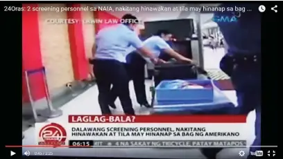  ??  ?? A VIDEO grab of GMA’s ‘24 Oras’ newscast shows two airport personnel opening the luggage of American missionary Lane Michael White who was caught allegedly in possession of a bullet inside his luggage on Sept. 17 at the Ninoy Aquino Internatio­nal...