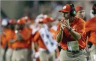  ?? SAM CRAFT — THE ASSOCIATED PRESS ?? Clemson head coach Dabo Swinney applauds during last week’s game against Texas A&amp;M in College Station, Texas. Clemson moved up its start time on Saturday to noon because of Hurricane Florence.