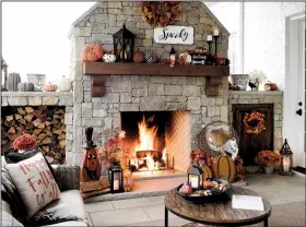  ?? Courtesy of Kirkland’s ?? Bring on the Fall – Pumpkins on the hearth, a fall throw pillow, maple leave wreaths, and a “Spooky” sign are simple moves that create a seasonal feeling at home.