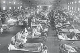  ?? WIKIMEDIA ?? Victims of the 1918 Spanish influenza crowded into an emergency hospital at Fort Riley, Kansas. The 1918 pandemic is believed to have killed more than 50 million people worldwide but Wisconsin had a coordinate­d strategy aided by the University of Wisconsin's expertise.