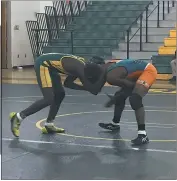  ?? PHOTO BY DEREK SABEDRA ?? Great Mills’ Tyrik Brooks, left, and Westlake’s Zayon Carter tangle during their 152-pound match Tuesday at Great Mills. Brooks secured the win on a first period fall.