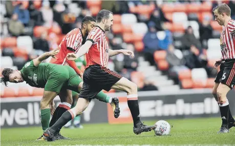  ??  ?? John O’Shea tries to work his way out of trouble against Preston earlier this month, with Lee Cattermole looking on.