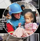  ?? ?? EVACUATED UNICEF worker takes young girl for better treatment in Beit Lahia