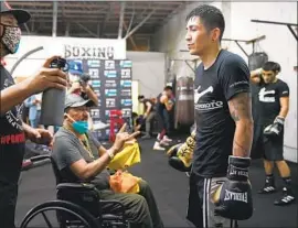  ?? Sean Michael Ham Premier Boxing Champions ?? LEO SANTA CRUZ prepares for his biggest test yet with father Jose, in a wheelchair, inspiring him by surviving a bout with COVID- 19 that almost killed him.