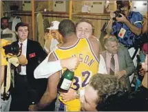  ?? Nathaniel S. Butler Getty I mages ?? PAT RILEY hugs Magic Johnson after the Lakers backed up the coach’s guarantee by capturing the NBA crown again in 1988.