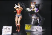  ??  ?? A Wonder Woman figure is among the many pop-culture items available at ThinkGeek.