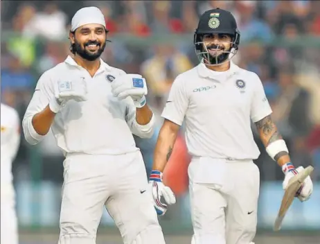 ?? BCCI ?? ▪ Murali Vijay (left) celebrates his century as India captain Virat Kohli looks on during Day 1 of the third Test against Sri Lanka at the Ferozeshah Kotla on Saturday.