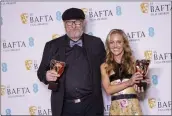  ?? VIANNEY LE CAER — INVISION/AP ?? Ian Stokell, left, and Lesley Paterson, winners of the best film award for “All Quiet on the Western Front” at the 76th British Academy Film Awards on Sunday.