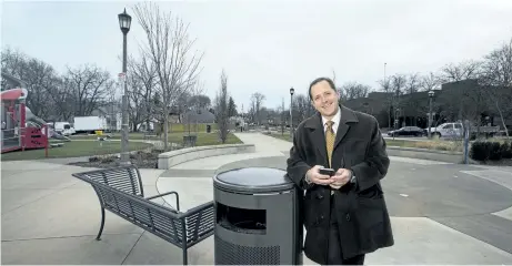  ?? JULIE JOCSAK/POSTMEDIA NETWORK ?? Niagara Falls Mayor Jim Diodati with a smart garbage can that will relay when it is full via wifi to the city.