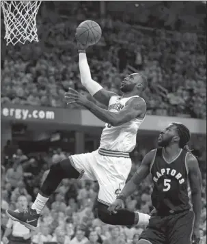  ?? The Associated Press ?? GOING UP: Cleveland Cavaliers’ LeBron James (23) drives past Toronto Raptors’ DeMarre Carroll (5) in the first half in Game 1 of a second-round NBA playoff series Monday in Cleveland.