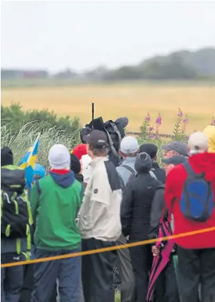  ??  ?? Phil Mickelson and Henrik Stenson wait on the tee during their third round at Royal Troon