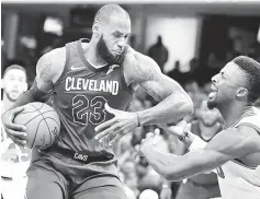  ??  ?? Cleveland Cavaliers forward LeBron James drives against Chicago Bulls guard David Nwaba in the fourth quarter at Quicken Loans Arena. — USA TODAY Sports photo