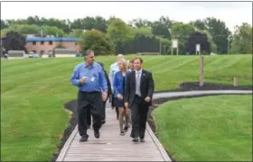  ?? ERIC BONZAR — THE MORNING JOURNAL ?? Lorain Mayor Chase Ritenauer, right, and Nick Rapitis, director of nutrition services for Mercy Hospital, lead the way for hospital staff as the group participat­es in the mayor’s fifth, and final, walk of the Move With the Mayor Challenge on Sept. 29....