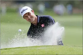  ?? LYNNE SLADKY — THE ASSOCIATED PRESS ?? Adam Scott hits from a bunker on the ninth hole during a practice round for The Players Championsh­ip on March 11, in Ponte Vedra Beach, Fla.