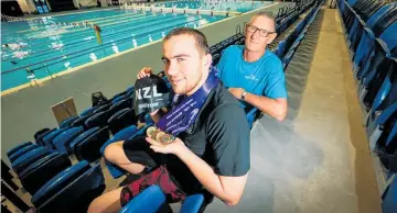  ?? Photo / Paul Taylor ?? Champion swimmer Lance Dustow and coach Gary Knight.