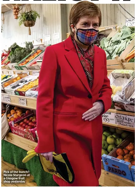  ??  ?? Pick of the bunch?: Nicola Sturgeon at a Glasgow fruit shop yesterday