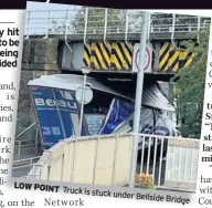  ??  ?? LOW POINT Truck is stuck under Bellside Bridge