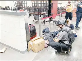  ?? COURTESY PHOTO ?? First responders from many agencies in Washington and Benton counties participat­e in an active shooter or “aggressive person” drill at Farmington High School.