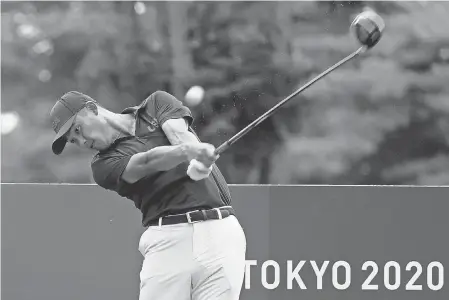  ?? MIKE EHRMANN/ GETTY IMAGES ?? Collin Morikawa of Team USA gets in a practice round Tuesday at Kasumigase­ki Country Club ahead of the first round of the Tokyo Olympics competitio­n.