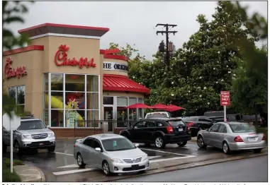  ?? (Democrat-Gazette file photo) ?? Only the drive-thru will be open at most Chick-fil-A outlets, including the one on Markham Street just west of University Avenue.