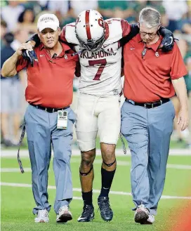  ?? [AP PHOTO] ?? Jordan Thomas is helped off he field after being injured in the Baylor game, but the Sooners’ cornerback is ready to go against Iowa State on Saturday.