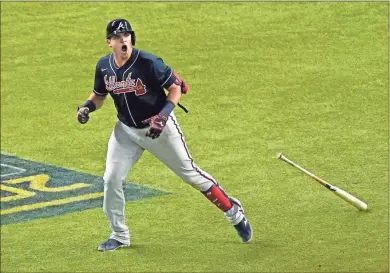  ?? Sue Ogrocki ?? Atlanta Braves’ Austin Riley celebrates a run home against the Los Angeles Dodgers during the ninth inning in Game 1 of a baseball National League Championsh­ip Series Arlington, Texas, on Monday.