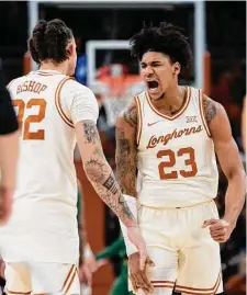  ?? Stephen Spillman/Associated Press ?? Dillon Mitchell, right, shows the passion with which Texas played Monday night in rebounding from a loss to Tennessee.