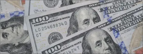  ?? AP PHOTO/LM OTERO ?? THIS JAN. 22, 2020, FILE PHOTO shows the likeness of Benjamin Franklin on $100 bills in Dallas. The truth is, despite a record windfall in federal tax revenue – it’s up 26% over the first five months of fiscal 2022 – Washington is currently spending $2 trillion more than it’s taking in.