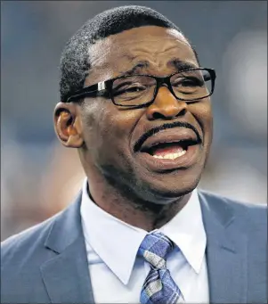  ?? AP PHOTO/RON JENKINS, FILE ?? In this Sept. 1, 2016, file photo, broadcast personalit­y and former Dallas Cowboys player Michael Irvin talks with people on the field before a preseason NFL football game between the Cowboys and Houston Texans, in Arlington, Texas.