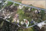  ?? ROBERT COHEN — ST. LOUIS POST-DISPATCH VIA AP ?? Debris marks the spots Wednesday where Tuesday’s tornado destroyed homes in Perryville, Mo.