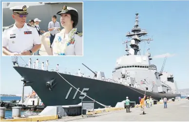  ??  ?? JAPANESE WARSHIP – The ‘JS Akizuki,’ a guided missile destroyer of Japan, docks at the Alava Wharf, Subic Bay Freeport Zone, Olongapo City yesterday. Inset, Philippine Navy Commander Jonathan Zata (left) chats with Japan Maritime Self-Defense Force...