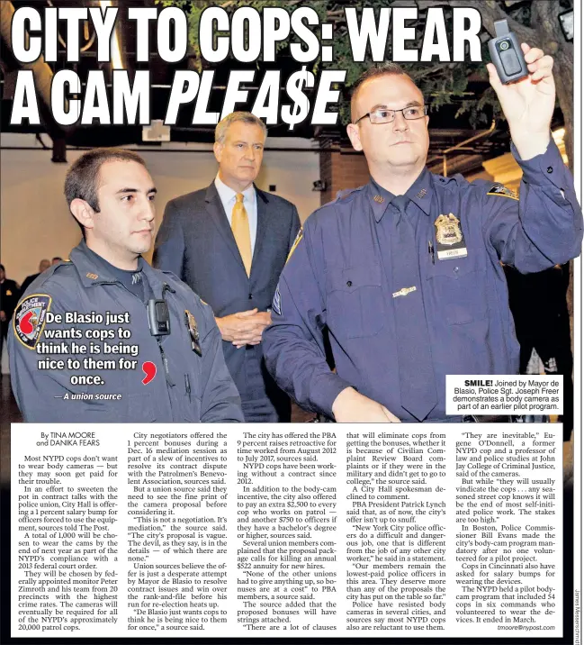  ??  ?? SMILE! Joined by Mayor de Blasio, Police Sgt. Joseph Freer demonstrat­es a body camera as part of an earlier pilot program.