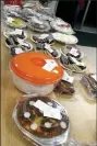  ??  ?? More than 70 homemade desserts were up for auction, including traditiona­l and more experiment­al flavors of baked goods.