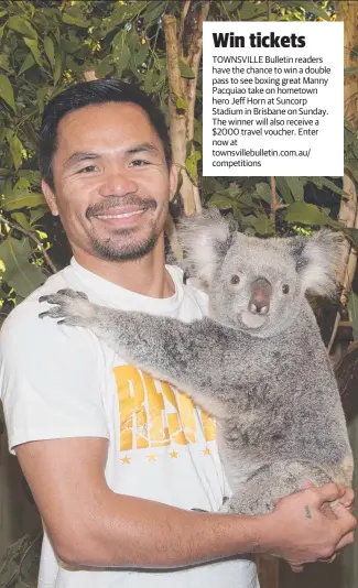  ?? BEAR HUG: Boxing legend Manny Pacquiao meets a local yesterday. ??