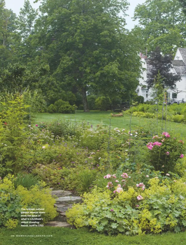  ??  ?? The relaxed, natural garden sweeps down from the back of what is Litchfield’s oldest standing house, built in 1753