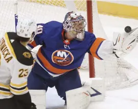  ?? AP ?? ‘FIND HIS WAY’: Bruins forward Jack Studnicka, who did not have a shot on net on Monday night, watches Islanders goaltender Semyon Varlamov make a save.