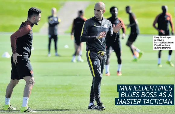  ??  ?? Ilkay Gundogan receives instructio­ns from Pep Guardiola during training