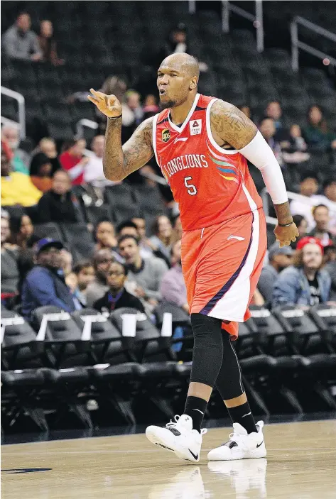  ?? — AP PHOTO ?? Marreese Speights of the Chinese Basketball Associatio­n’s Guangzhou Long-Lions shows his delight after sinking a basket in the team’s exhibition game against the NBA’s Washington Wizards Friday in Washington.