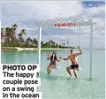  ??  ?? PHOTO OP The happy couple pose on a swing in the ocean