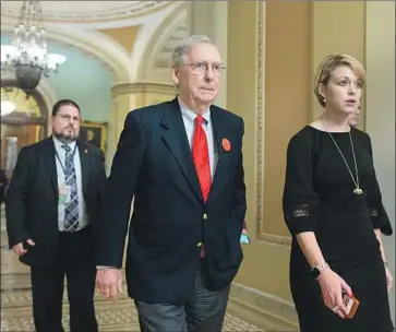  ?? Michael Reynolds EPA/Shuttersto­ck ?? SENATE GOP leader Mitch McConnell showed off his button for the “Senate Cranky Coalition” on Friday. Republican­s and Democrats alike were visibly frustrated to be stuck in Washington as the shutdown loomed.