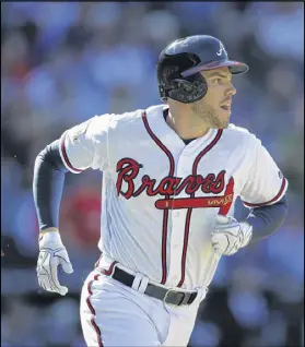  ?? TAYLOR CARPENTER / TAYLOR.CARPENTER@AJC.COM ?? Braves star Freddie Freeman, who sees the shift often, questions the tactic’s effectiven­ess. “Actually, I feel like the shift gives up more hits than it saves,” he says.